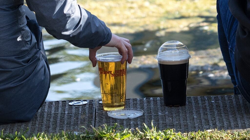People with takeaway pints alongside the Grand Canal in Portobello, Dublin. Photograph: Damien Eagers