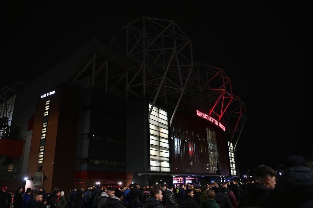 Fans arrive outside Old Trafford prior to Friday night's FA Cup third round match between Manchester United and Everton. Photograph: Gareth Copley/Getty Images
