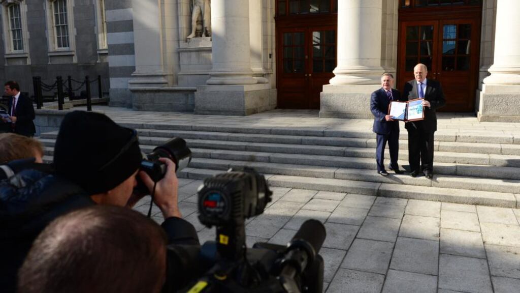 Michael Noonan and Brendan Howlin before delivering Budget 2014. Photograph: Bryan O’Brien