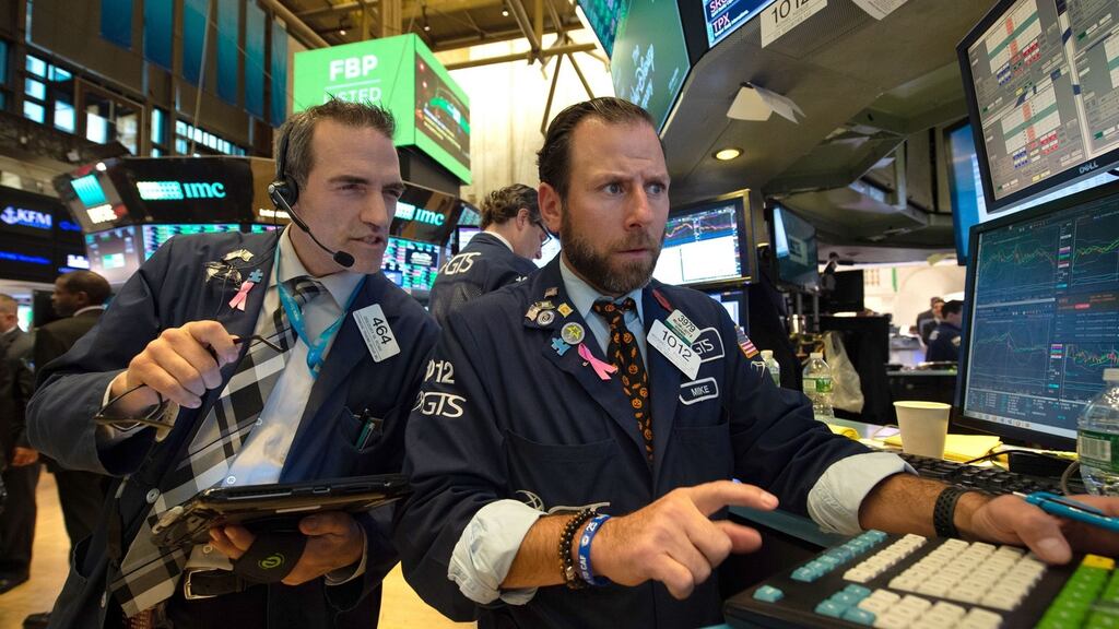 Traders work on the floor of the New York Stock Exchange. Shares of Facebook gained 3.7 per cent. Photograph: Bryan R. Smith/AFP