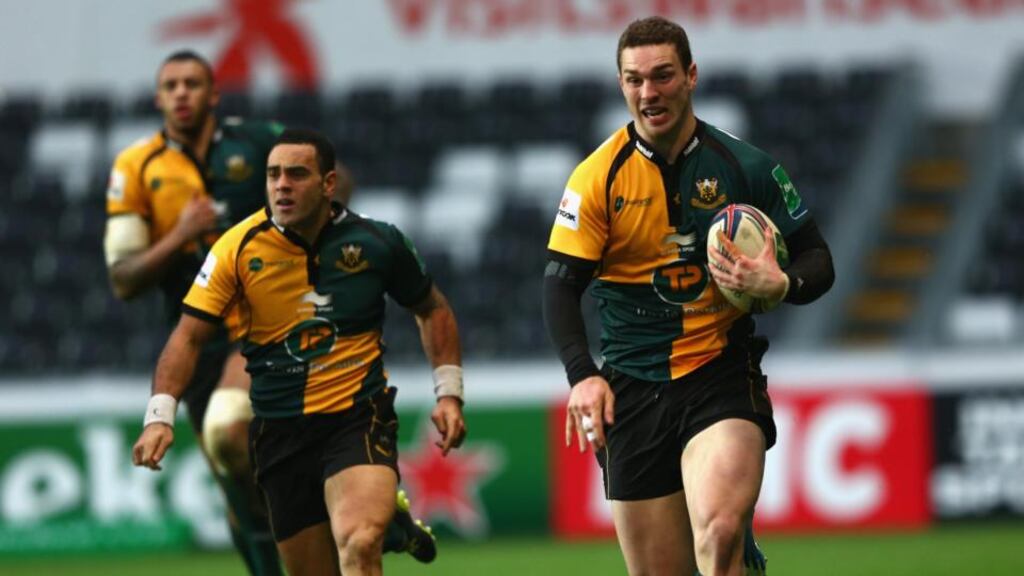 George North of Northampton Saints sprints clear to score a try during the Heineken Cup Pool One match between Ospreys and Northampton Saints at the Liberty Stadium in Wales yesterday. Photograph: Michael Steele/Getty Images
