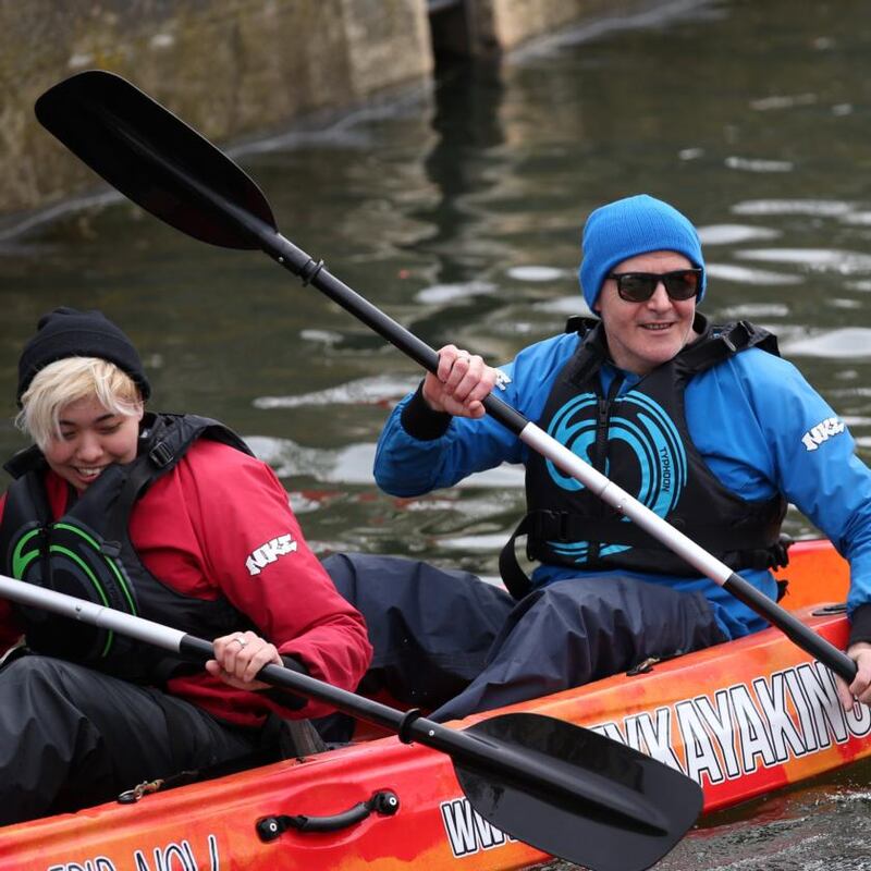 Kayaking on the Liffey: Conor Pope tours Dublin with Tessa Berry, a US tourist. Photograph: Laura Hutton