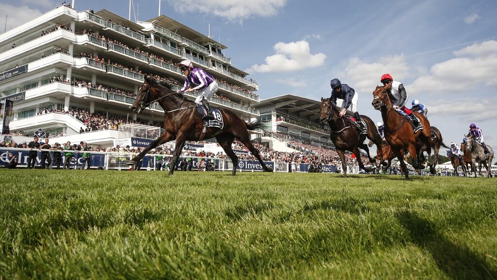 Padraig Beggy riding Wings Of Eagles to win The Investec Derby from Cliffs Of Moher at Epsom. Photograph: Alan Crowhurst/Getty Image