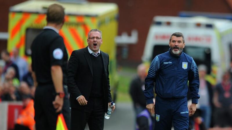 Manager Paul Lambert of Aston Villa and assistant Roy Keane (right) on the touchline during the Barclays Premier League match at Stoke City. Photograph: Chris Brunskill/Getty Images
