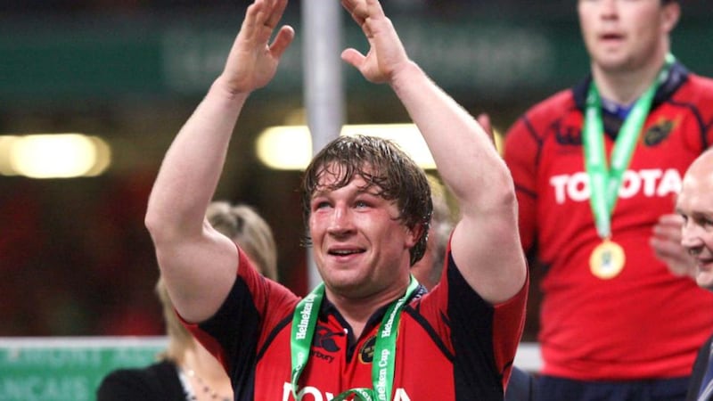 Munster’s  Jerry Flannery gets his hands on a Heineken Cup medal in 2006. Photograph: Billy Stickland/Inpho