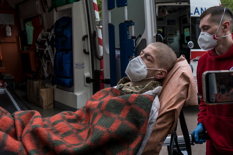 A Ukrainian prisoner of war arrives by ambulance. Photograph: Brendan Hoffman/New York Times