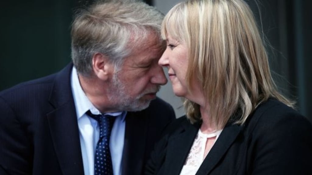 A file image of Securicor worker Paul Richardson and his wife Marie outside the Criminal Courts of Justice in Dublin. Photograph: Collins Courts
