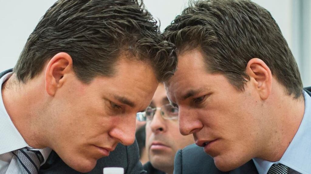 Brothers Cameron (left) and Tyler Winklevoss talk to each other as they attend a New York State Department of Financial Services (DFS) virtual currency hearing in New York in January. In a blog post, the Winklevoss brothers said they used bitcoins to buy tickets for a high-altitude voyage on billionaire Richard Branson’s Virgin Galactic commercial spaceflight venture. Photograph: Lucas Jackson/Reuters