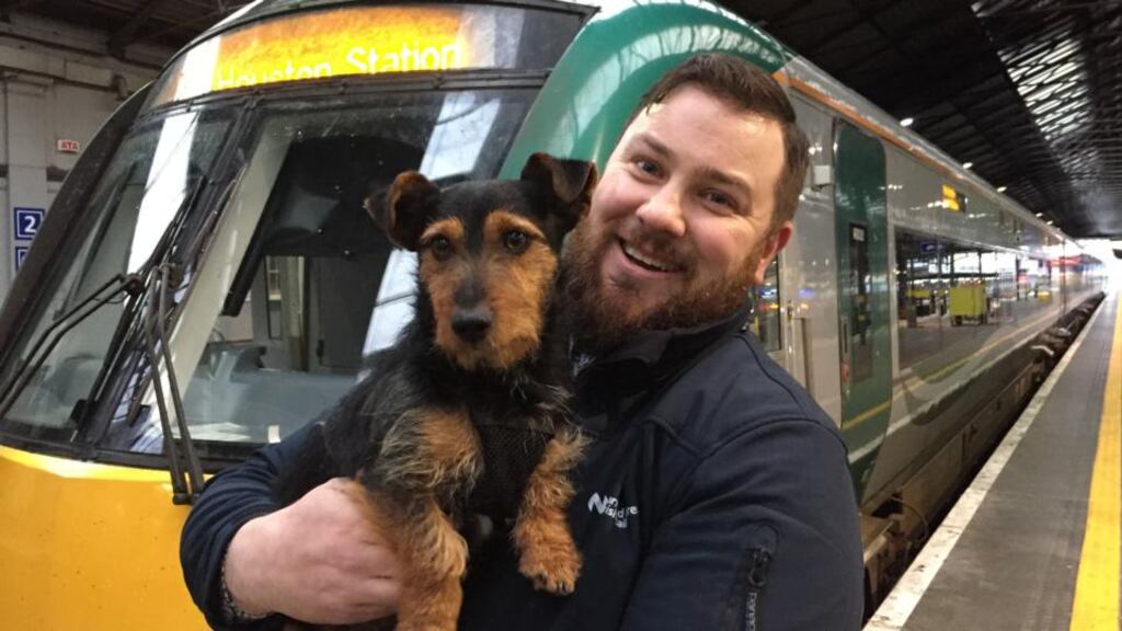 Irish Rail worker Ted Maher with Hamish who boarded a commuter train in Co Kildare and ended up at Dublin’s Heuston station on Wednesday. Photograph: David Young/PA
