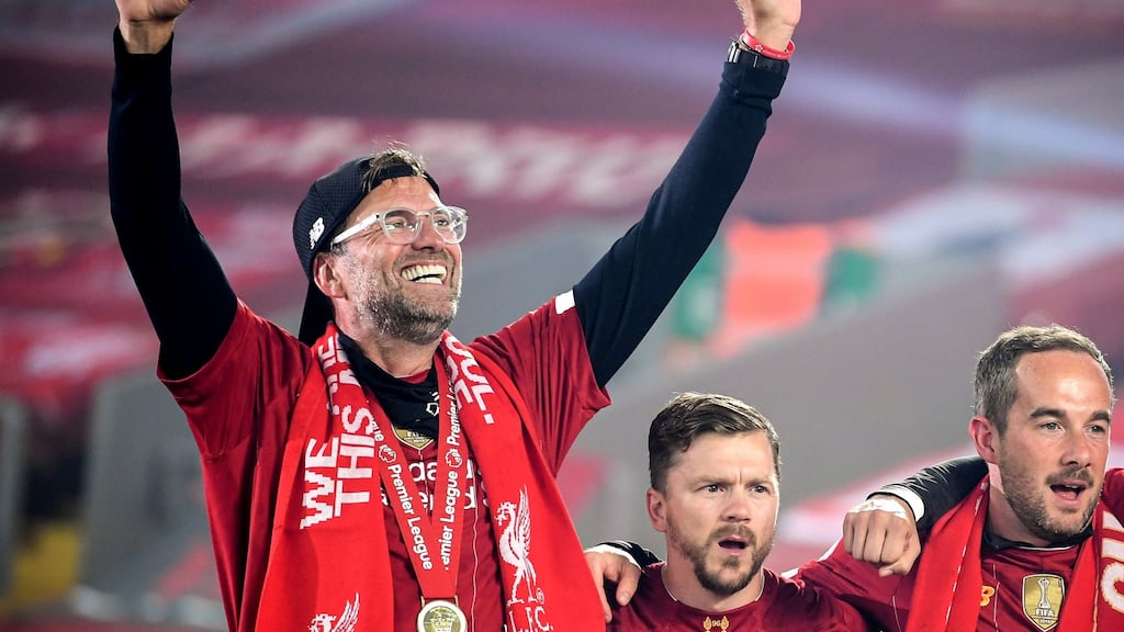 Liverpool manager Jurgen Klopp celebrates as his team lift the Premier League trophy. Photograph: EPA