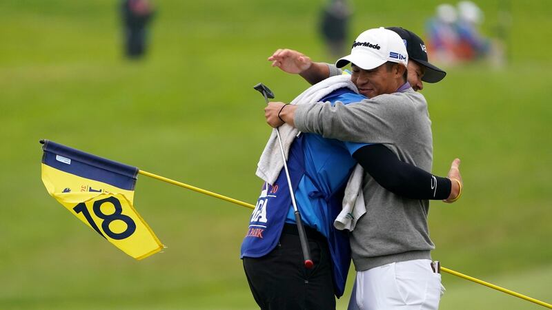 Collin Morikawa with his caddie Jonathan Jakovac on the 18th hole. Photograph: AP