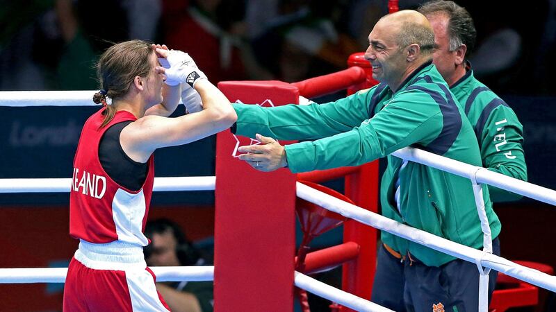 Katie Taylor celebrates her 2012 Olympic gold medal win in London with her father Pete. Photograph: Morgan Treacy/Inpho