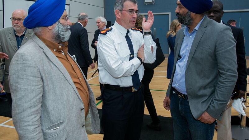 Garda Commissioner Drew Harris speaking to Gurbir Singh Chadha (left) and Ravinder Singh Oberoi from Lucan (right) during the launch the Garda Siochana Diversity and Integration Strategy 2019-2021 in Balbriggan, Dublin. Photograph: Gareth Chaney/Collins
