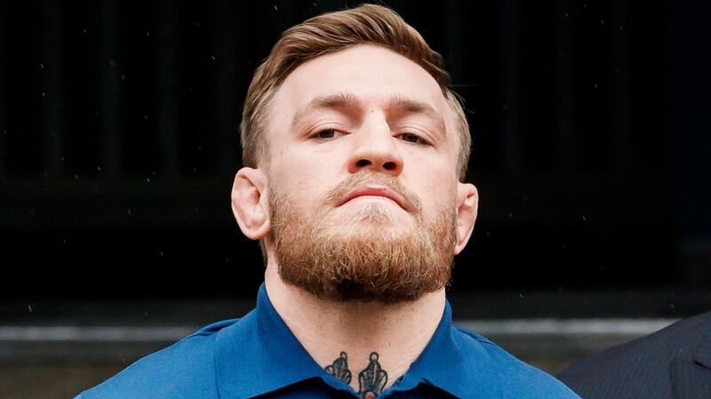 Mixed martial arts fighter Irish Conor McGregor is escorted from a New York City police precinct after he turned himself in and was arrested and charged with three counts of assault and one count of criminal mischief in Brooklyn, New York, US, April 6th, 2018. Photograph: Justin Lane/EPA