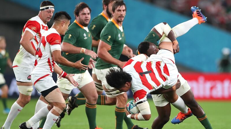 Japan’s Keita Inagaki is spear tackled by Sough Africa’s Tendai Mtawarira who received a yellow card. It could have merited a red. Photograph: Cameron Spencer/Getty Images