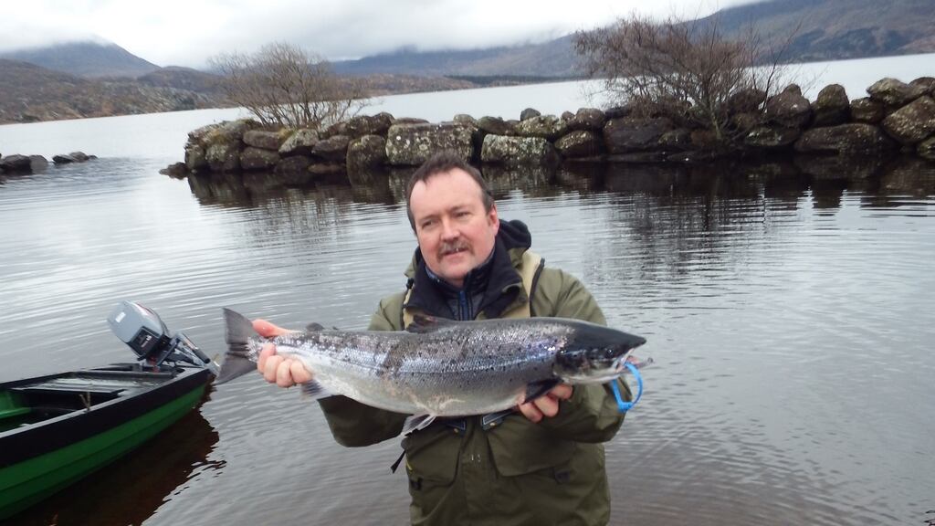 Angling guide Neil O’Shea with the first salmon of 2016 in Ireland caught on Lough Currane, Waterville, Co Kerry, last Tuesday at 10.50am. Photograph: Vincent Appleby