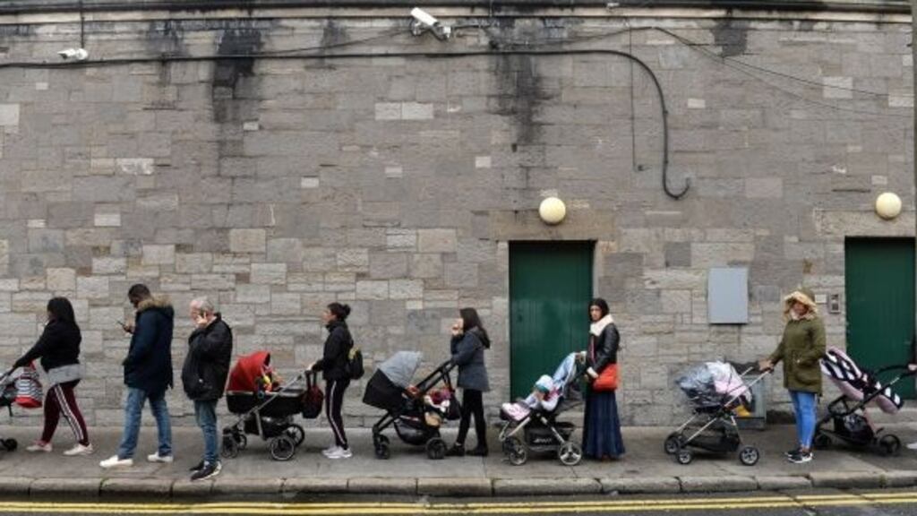 A queue forms outside the Capuchin Day Centre for family necessities on Monday morning. Photograph: Dara MacDónaill