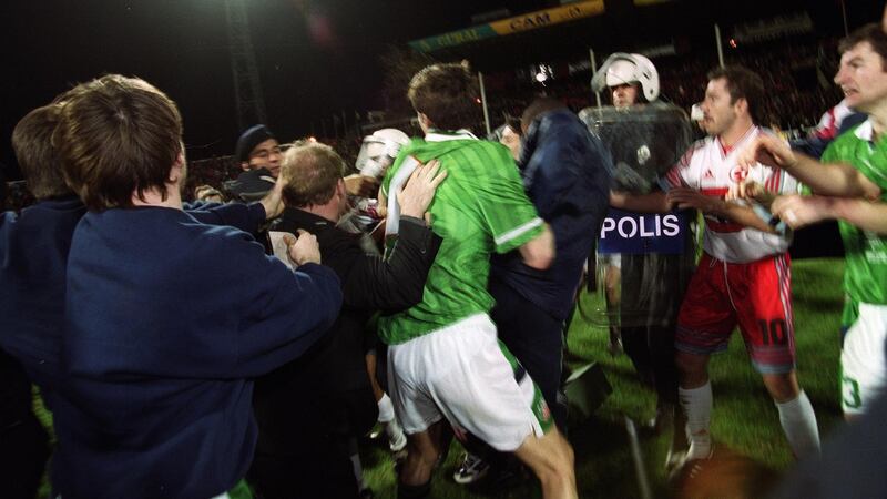 Tony Cascarino gets caught up in a brawl at the end of the match in Bursa. Photo: Patrick Bolger/Inpho