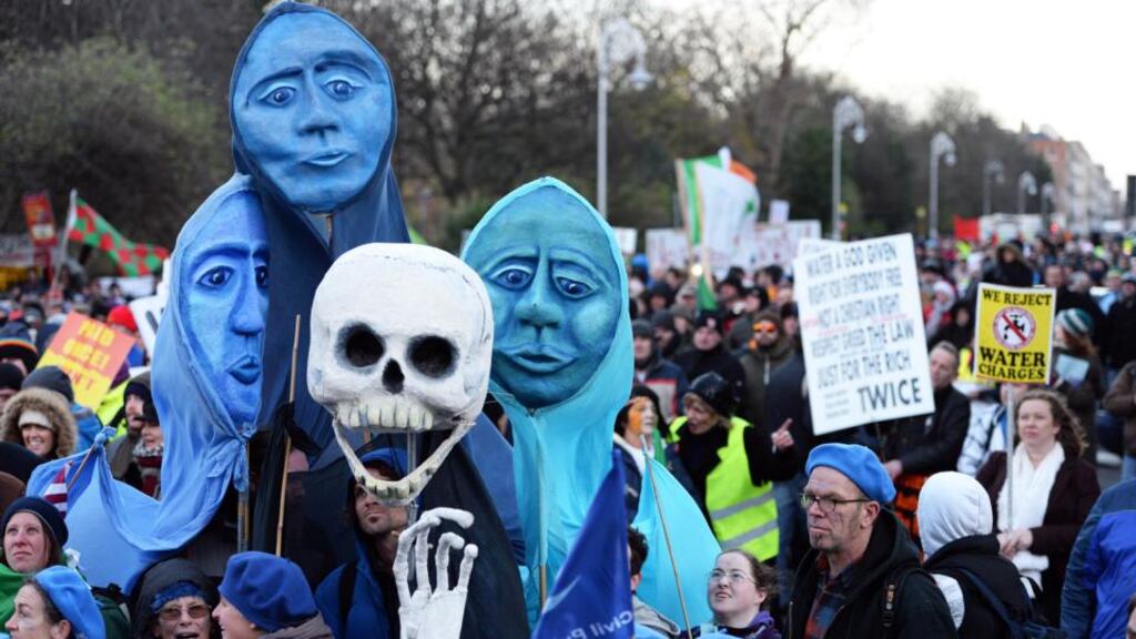 Water protesters on a demonstration at Merrion Square. Minister of State Simon Harris said the Coalition has provided “claritiy” on charges. Photograph: The Irish times