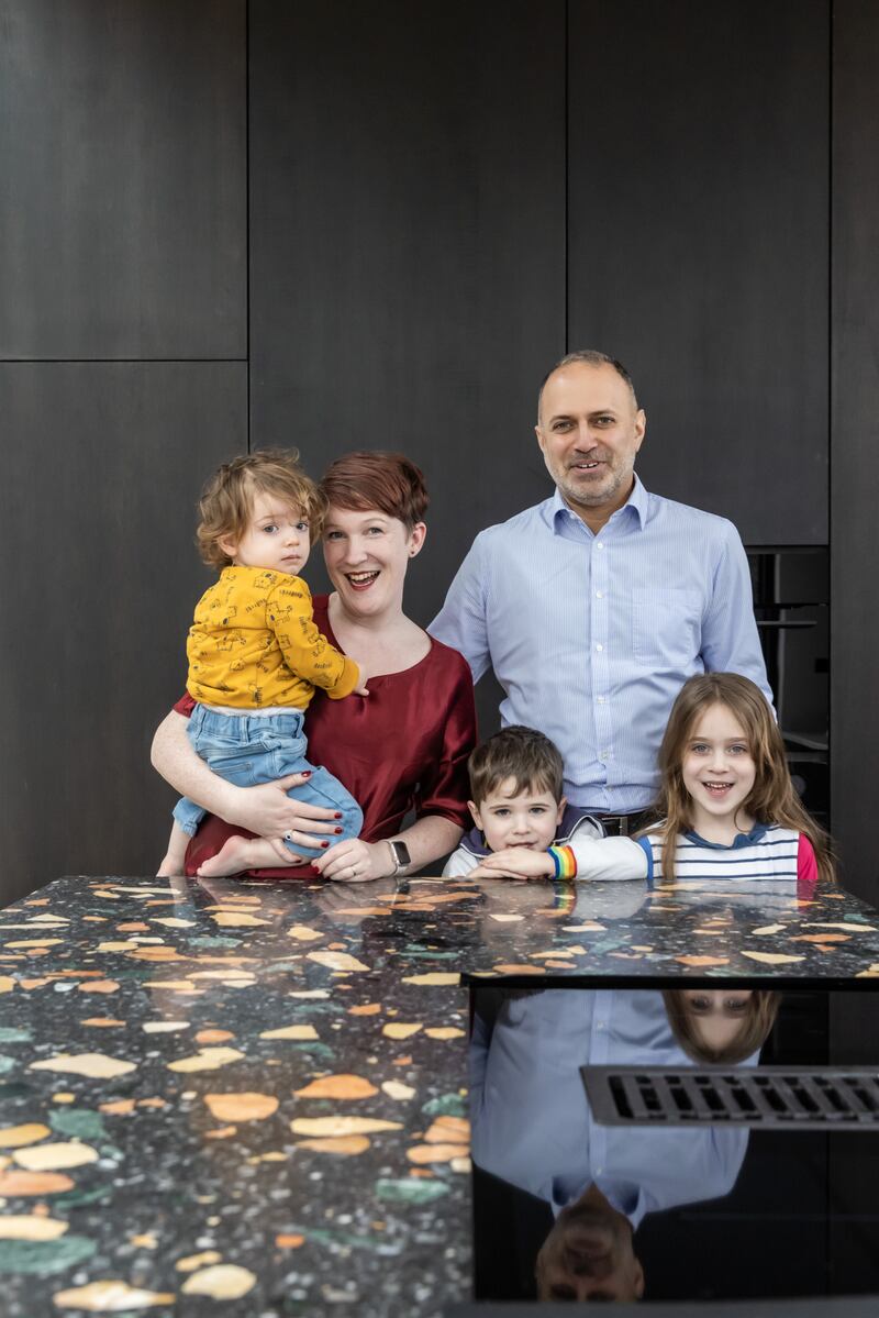 Clare Hayes-Brady and Mazen Al-Alawi with the family at home. Photograph: Ste Murray