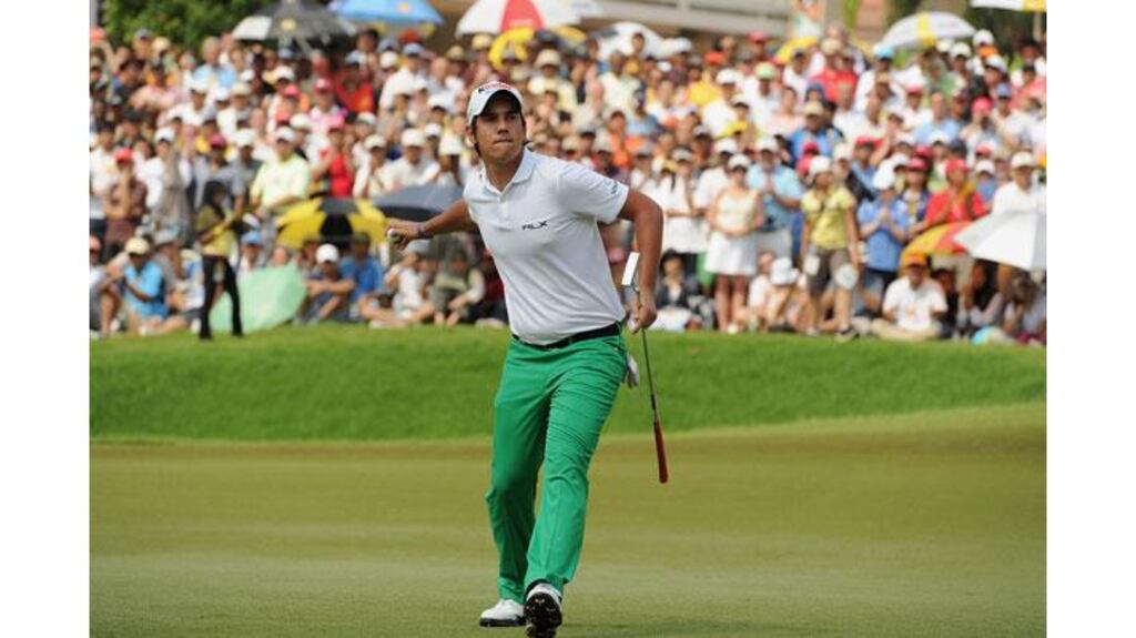 Italy's Matteo Manassero celebrates victory in the Maybank Malaysian Open at the Kuala Lumpur Golf and Country Club. Photograph: Khalid Redza/AFP/Getty Images