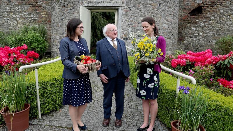 President Michael D Higgins, with on left Prof Jane Stout, Professor in botany at Trinity College and Dr Una FitzPatrick of the National Biodiversity Data Centre, in the gardens of Áras an Uachtaráin. Photograph: Maxwell’s