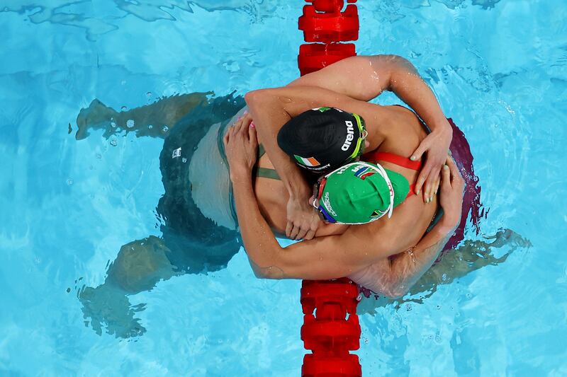Tatjana Smith of South Africa and Mona McSharry of Ireland celebrate after winning the gold and bronze medals in the Women’s 100m Breaststroke Final. Photograph: Richard Heathcote/Getty Images