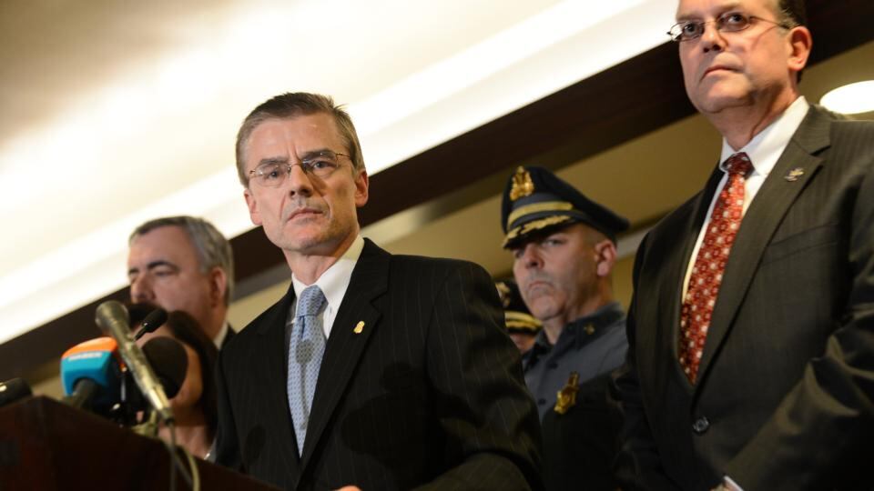 FBI Special Agent Richard DesLauriers, left, addresses reporters during a news conference releasing photos of suspects tonight. Photograph: Gretchen Ertl/The New York Times