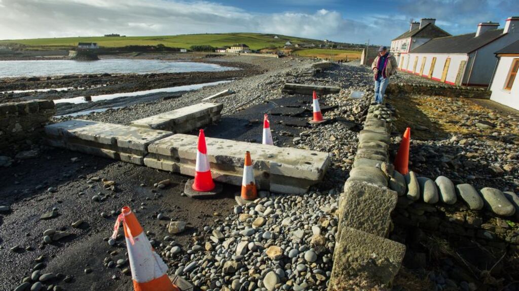 Undermined: the main road in Kilbaha, Co Clare, was ruined by the storms, which lifted rocks out of the pier and sent waves over houses. Photograph: John Kelly