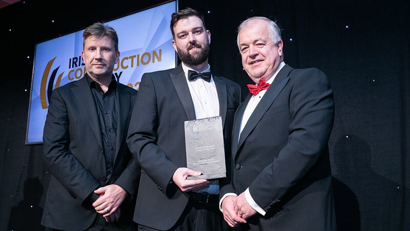 Stephen Grant, BIM manager, Petruf Consulting, presents the Health and Education Project of the Year award to Enda O'Connor and Rob Keane, JJ Rhatigan & Company and Reddy A+U.