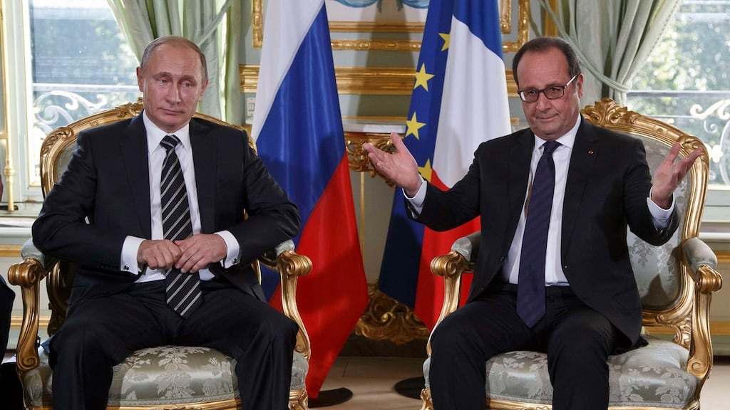 Stiff handshake: Russia’s president Vladimir Putin and French president Francois Hollande meet for bilateral talks before a summit to discuss the conflict in Ukraine in Paris. Photograph: Michel Euler/Reuters.