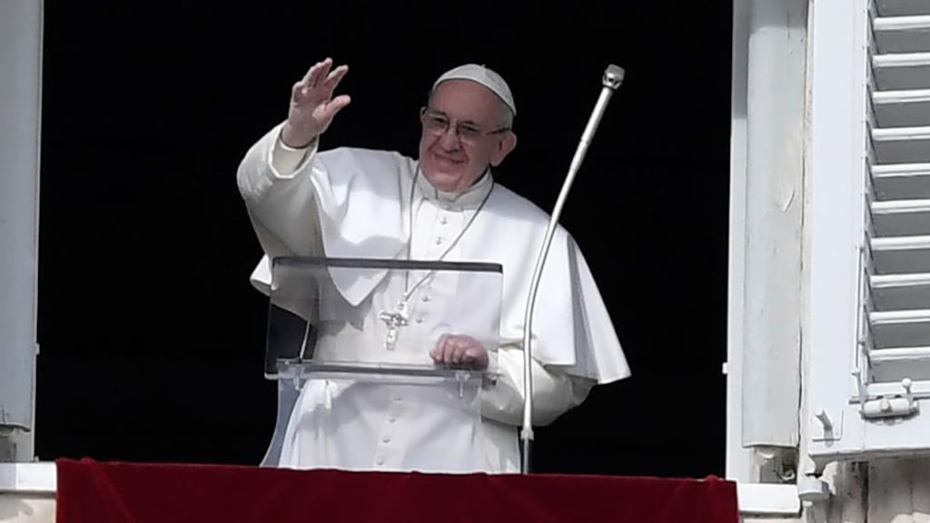 Pope Francis addresses the crowd from the window of the apostolic palace overlooking St Peter’s square in the Vatican during on Sunday. Photograph: AFP/Getty Images