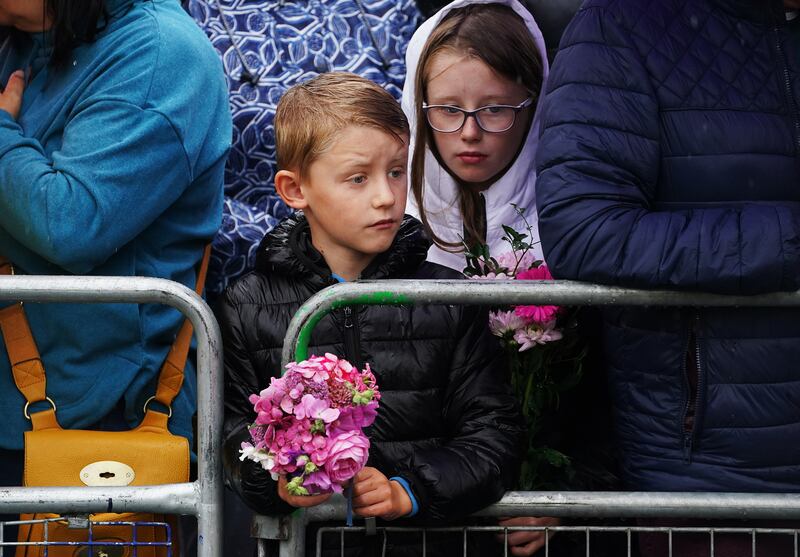 Members of the public at the gates of Hillsborough Castle Co. Down, following an Accession Proclamation Ceremony publicly proclaiming King Charles III as the new British monarch. Photograph: Brian Lawless / PA