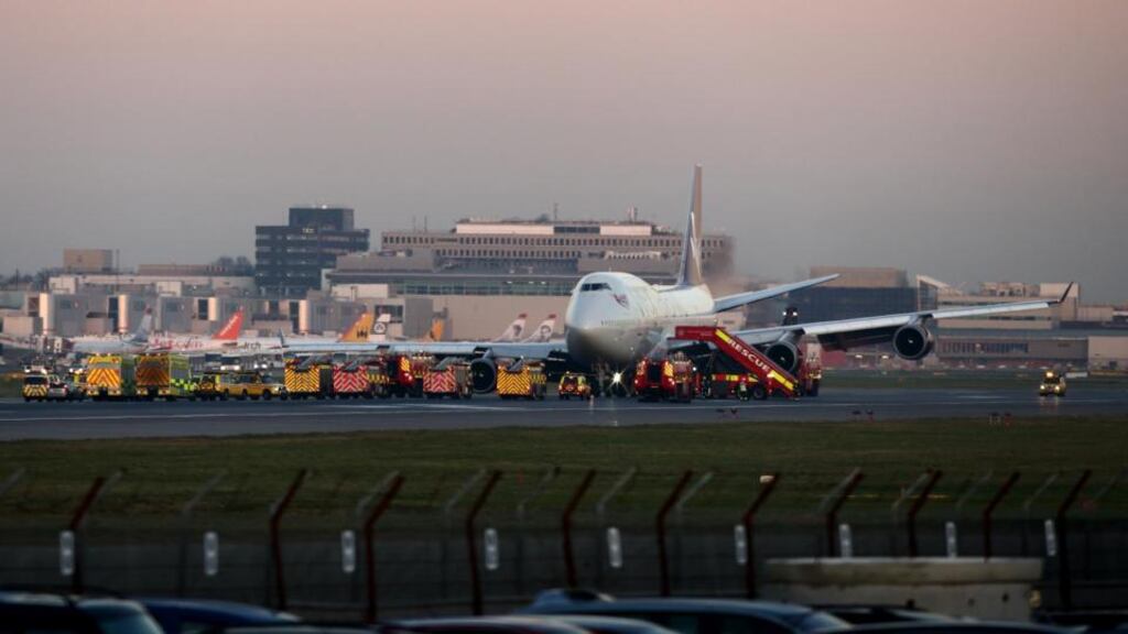 The Virgin Atlantic Boeing 747 is surrounded by emergency vehicles after landing safely at Gatwick airport. Photograph: Jordan Mansfield/Getty Images