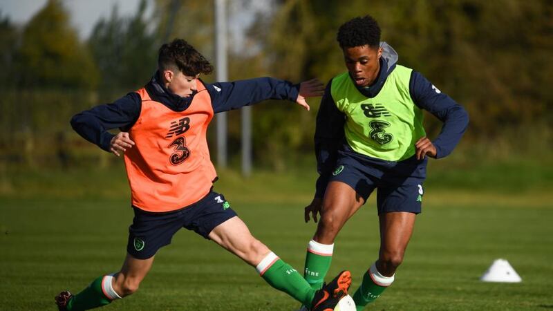 John Ryan, left, tackles Glory Nzinga during training. Photo: Stephen McCarth/Sportsfile