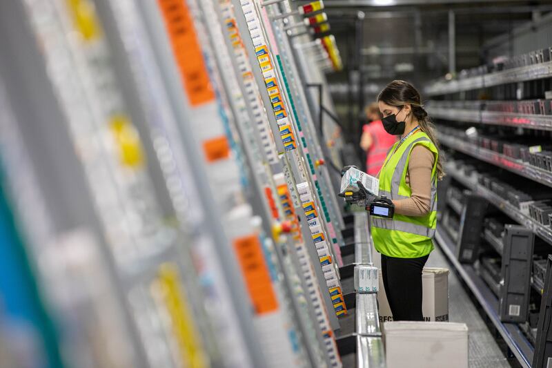 Workers have three minutes to scan, label and transfer batches of vaccines from the delivery vehicles, with a 20-second window to open and close the freezers