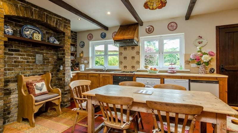 The fitted kitchen   has a rustic feel