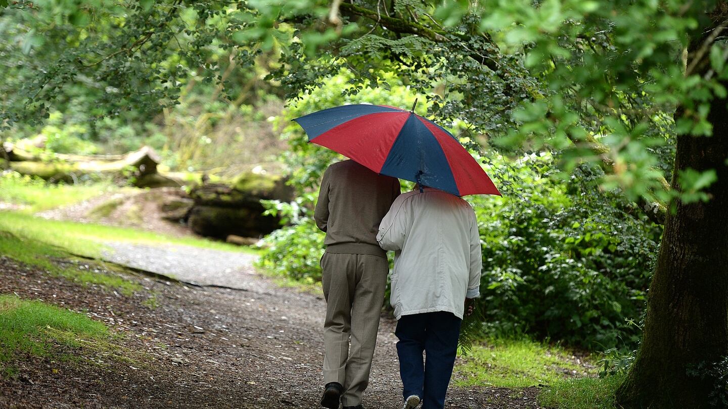 A  couple take a walk in the rain in Avondale, Co Wicklow. Photograph: Cyril Byrne