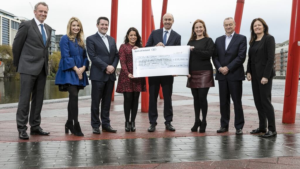 The sponsors of the Dragons at the Docks dragon boat racing event gathered at Grand Canal Docks to present a cheque to Dublin Simon Community for €233,000. Photograph: Fennell Photography
