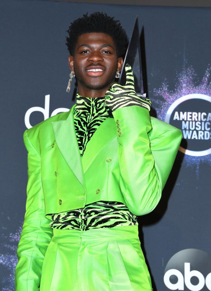 Lil Nas X poses in the green suit Christopher John Rogers designed for him at the 2019 American Music Awards at Microsoft Theater in Los Angeles. Photograph: Steve Granitz/WireImage