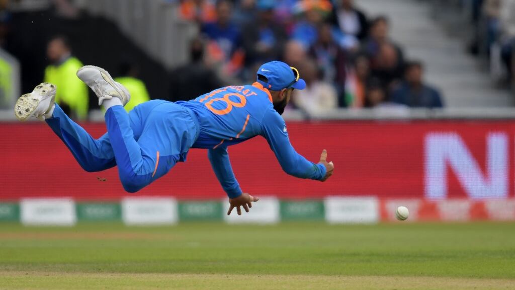 Virat Kohli in action during’s India’s rain-affected World Cup semi-final against New Zealand. Photograph: Dibyangshu Sarkar/AFP/Getty