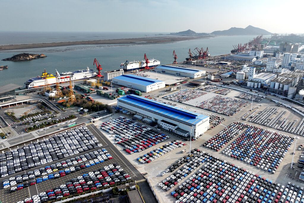 China's exports: Cars and pickups on the dock waiting to be loaded onto ships for export at the port in Lianyungang, in China's eastern Jiangsu province
(Photo by AFP)
