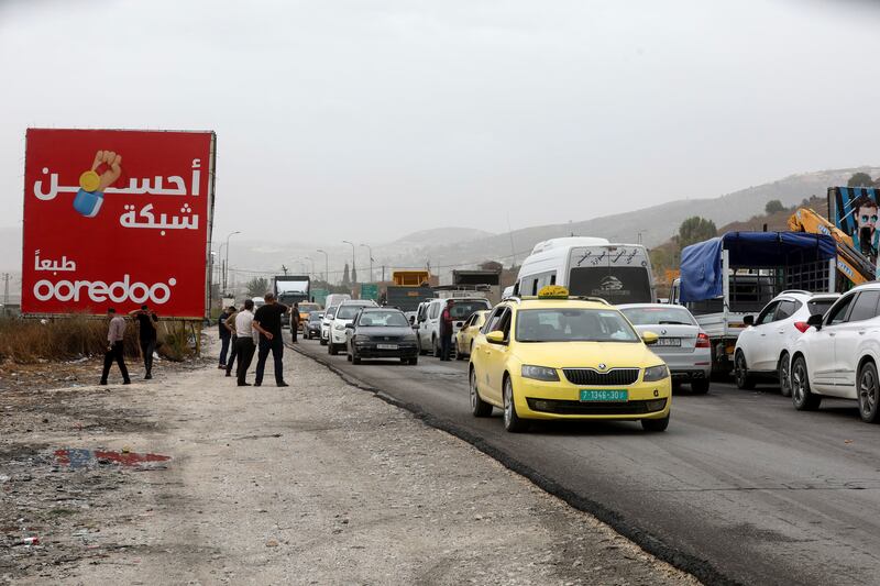Palestinians in their cars waiting to cross a checkpoint near the West Bank city of Nablus. Photograph: EPA