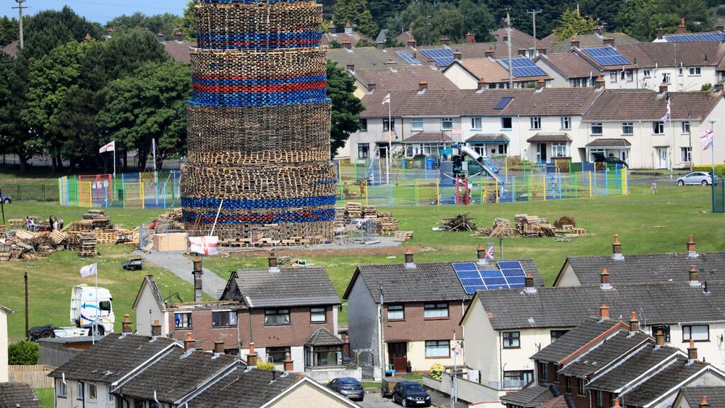 A bonfire in the loyalist Craigyhill area of Larne dwarfs local houses in the seaside town. Photograph: Peter Morrison/PA Wire