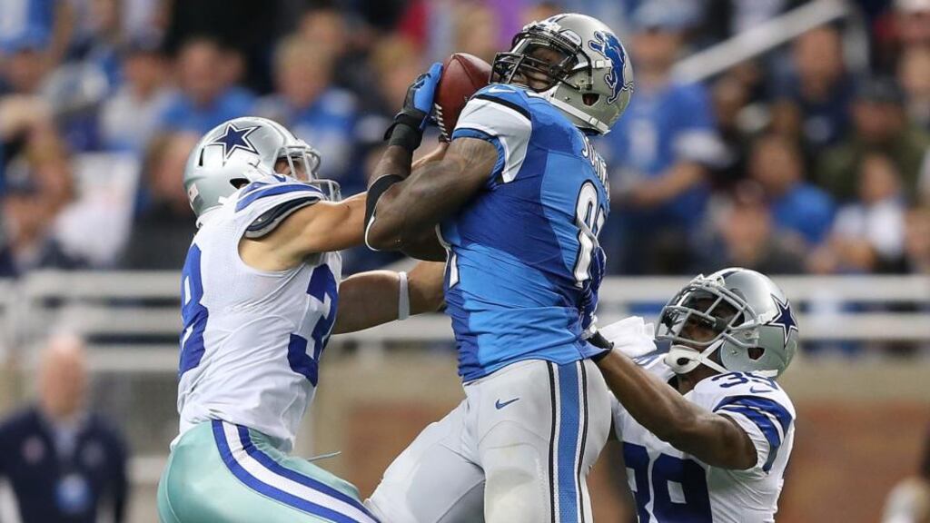 Detroit Lions wide receiver Calvin Johnson (centre) had 329 yards receiving in his side’s win over the Dallas Cowboys, the second-most in NFL history. Photograph: Leon Halip/Getty Images