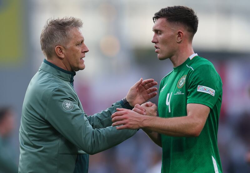 Heimir Hallgrímsson with Dara O'Shea during Ireland's defeat by England on Saturday. Photograph: James Crombie/Inpho