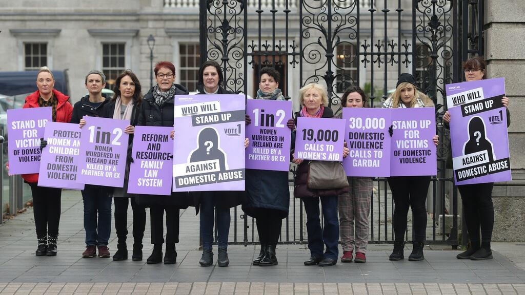 Sarah Benson (centre), chief executive of Women’s Aid,  and her colleagues launch their manifesto for general election 2020 outside the Dáil in Dublin on Friday. Photograph: Damien Eagers/The Irish Times