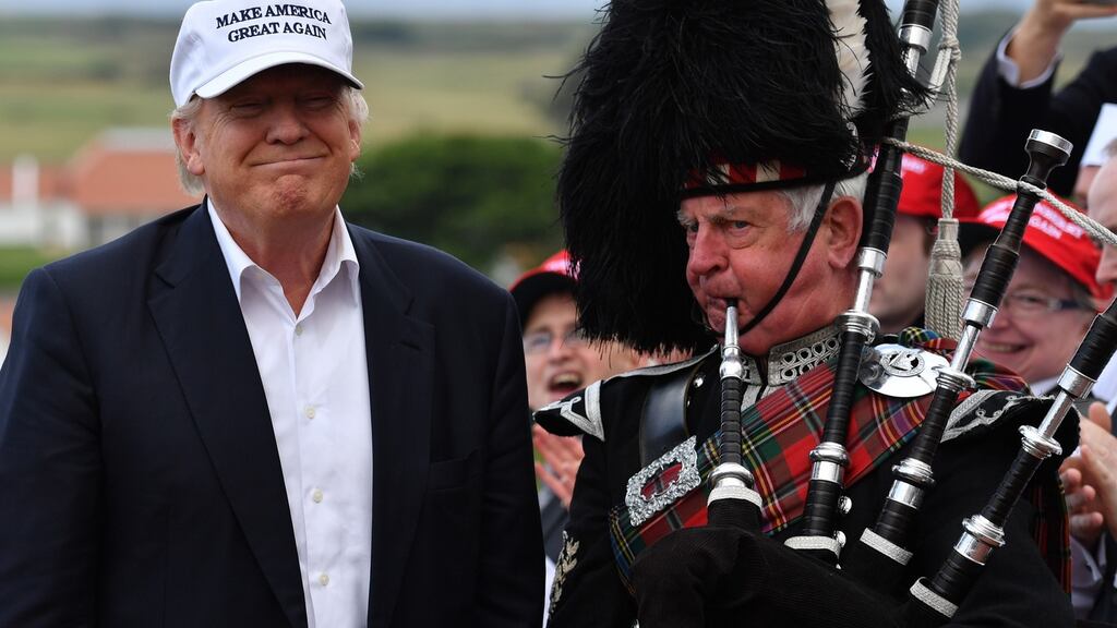 A bagpipe player welcomes presumptive Republican nominee for the US presidential election Donald Trump as he arrives at his Trump Turnberry resort in Ayr, Scotland. Photograph: Jeff J Mitchell/Getty Images