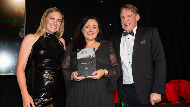 Cloe Stapleton, recruitment and business director, Osborne, presents the Employer of the Year award to Anna Savage and Mark O'Connor, Fexco.