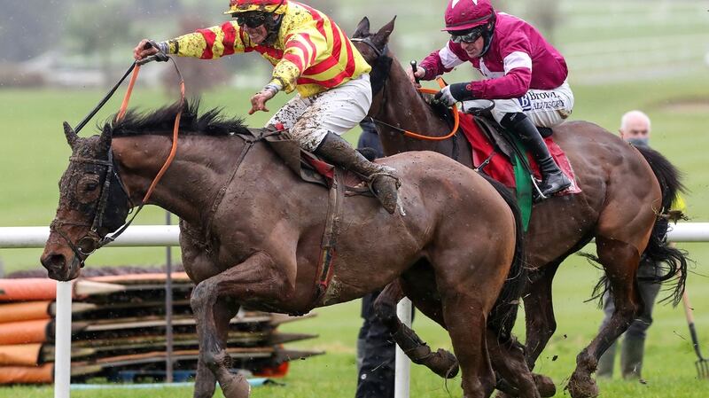 Sams Profile and Phillip Enwright en-route to taking the Galmoy Hurdle. Photograph: Caroline Norris/Inpho